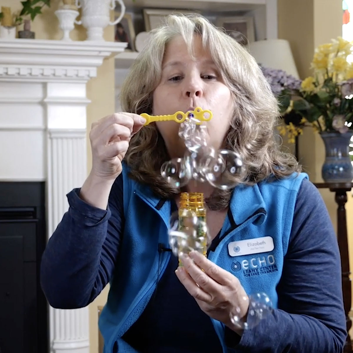 Elizabeth blowing bubbles