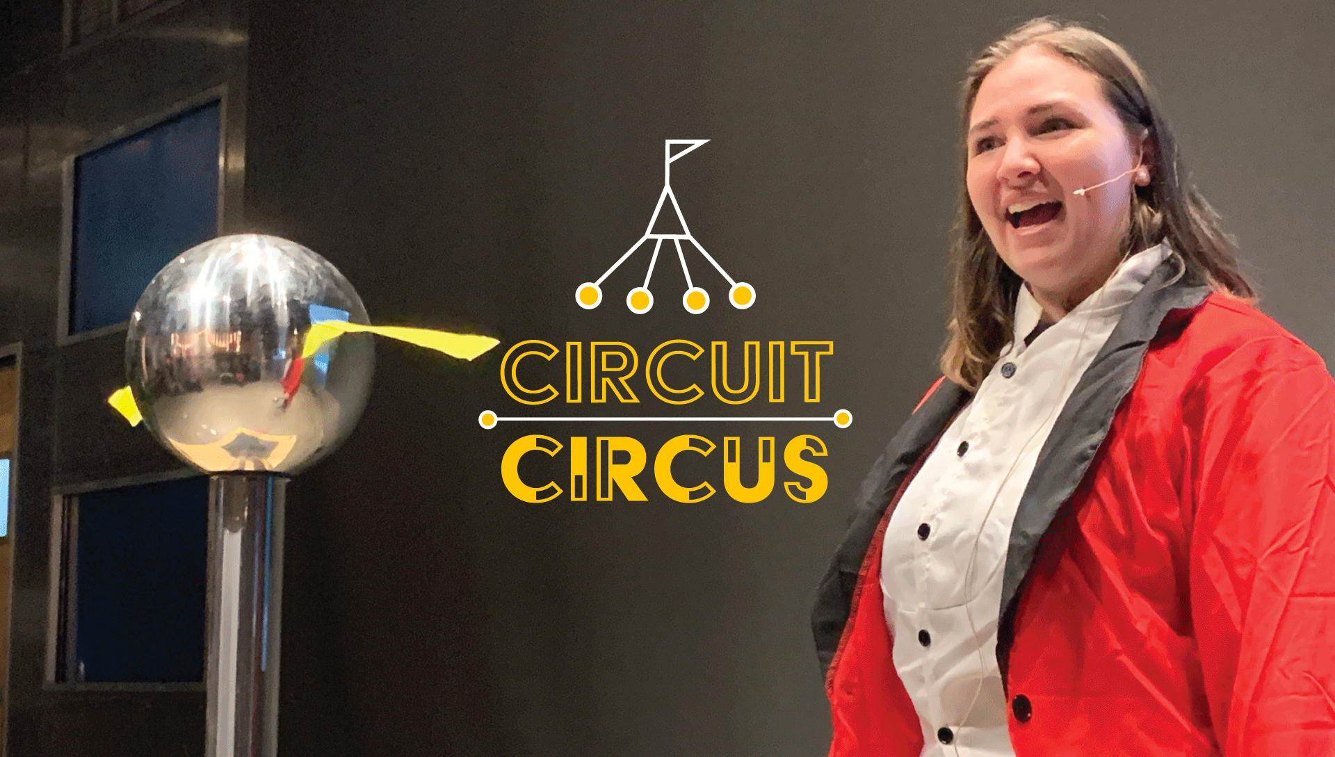 Image of an Educator in a red ring leader coat doing a demo with electricity. Image has "Circuit Circus" logo on top.